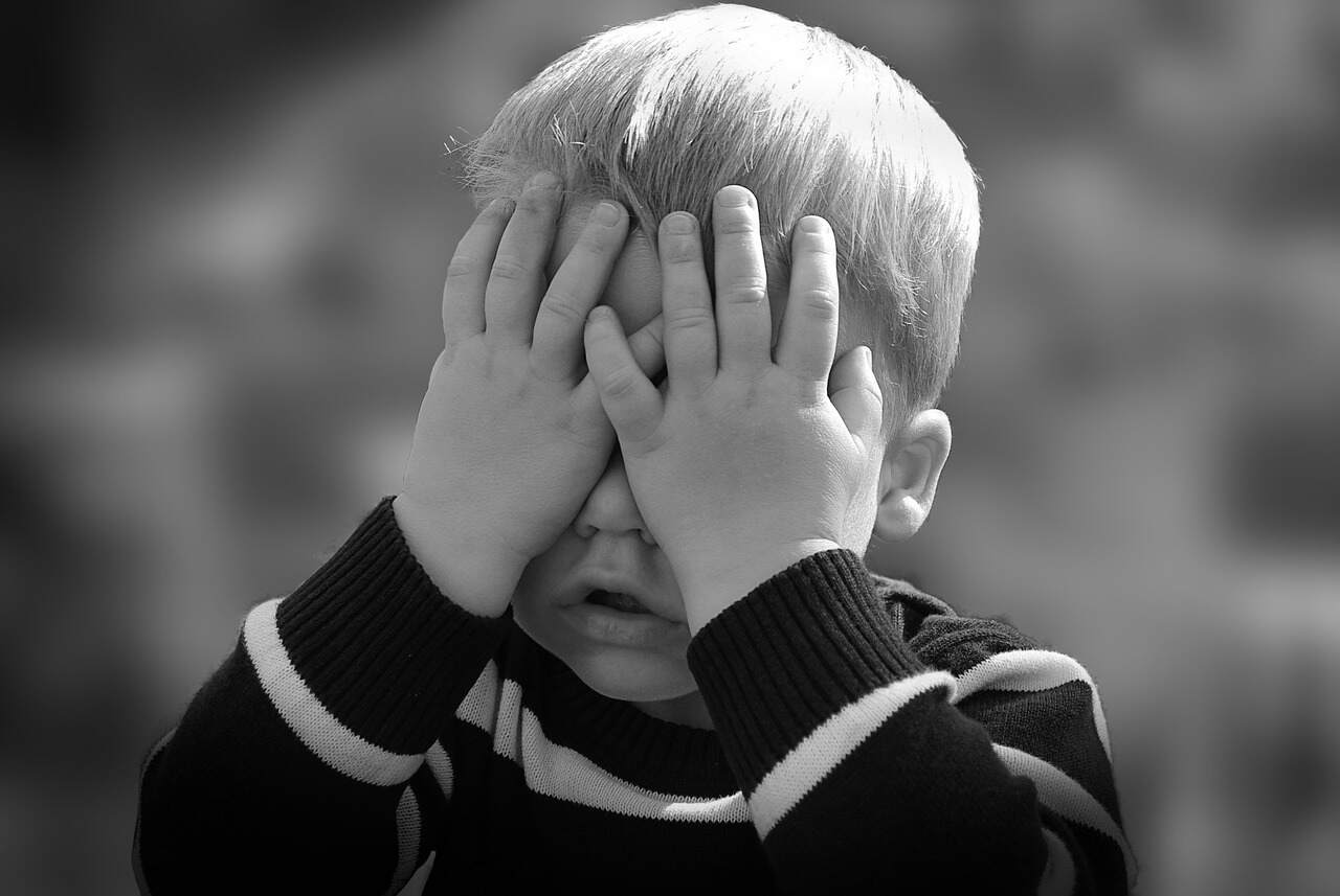 a child covering their eyes